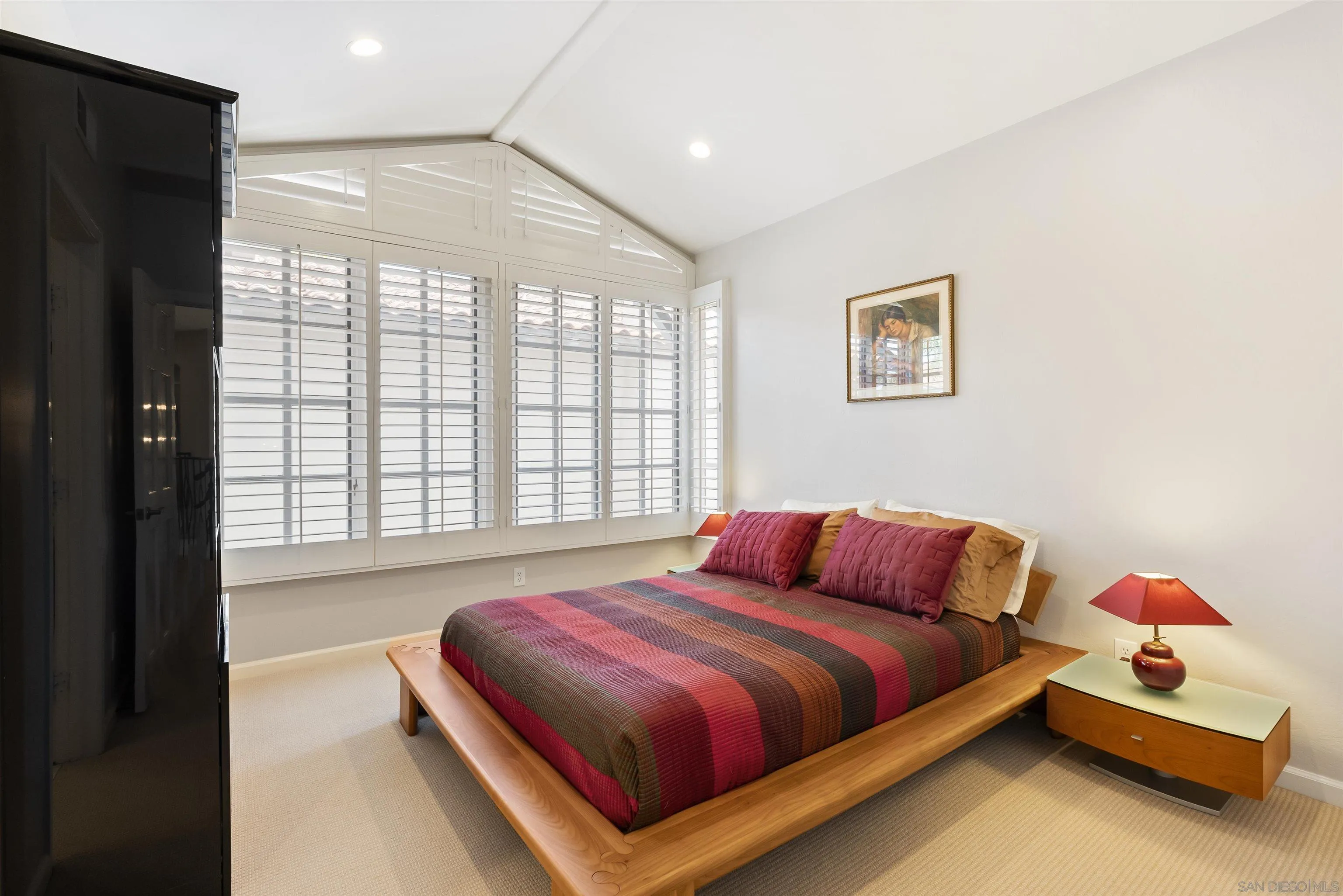 7715 Ivanhoe Avenue La Jolla, CA 92037 - Photo 24 of 28 a bedroom with a bed and a large window