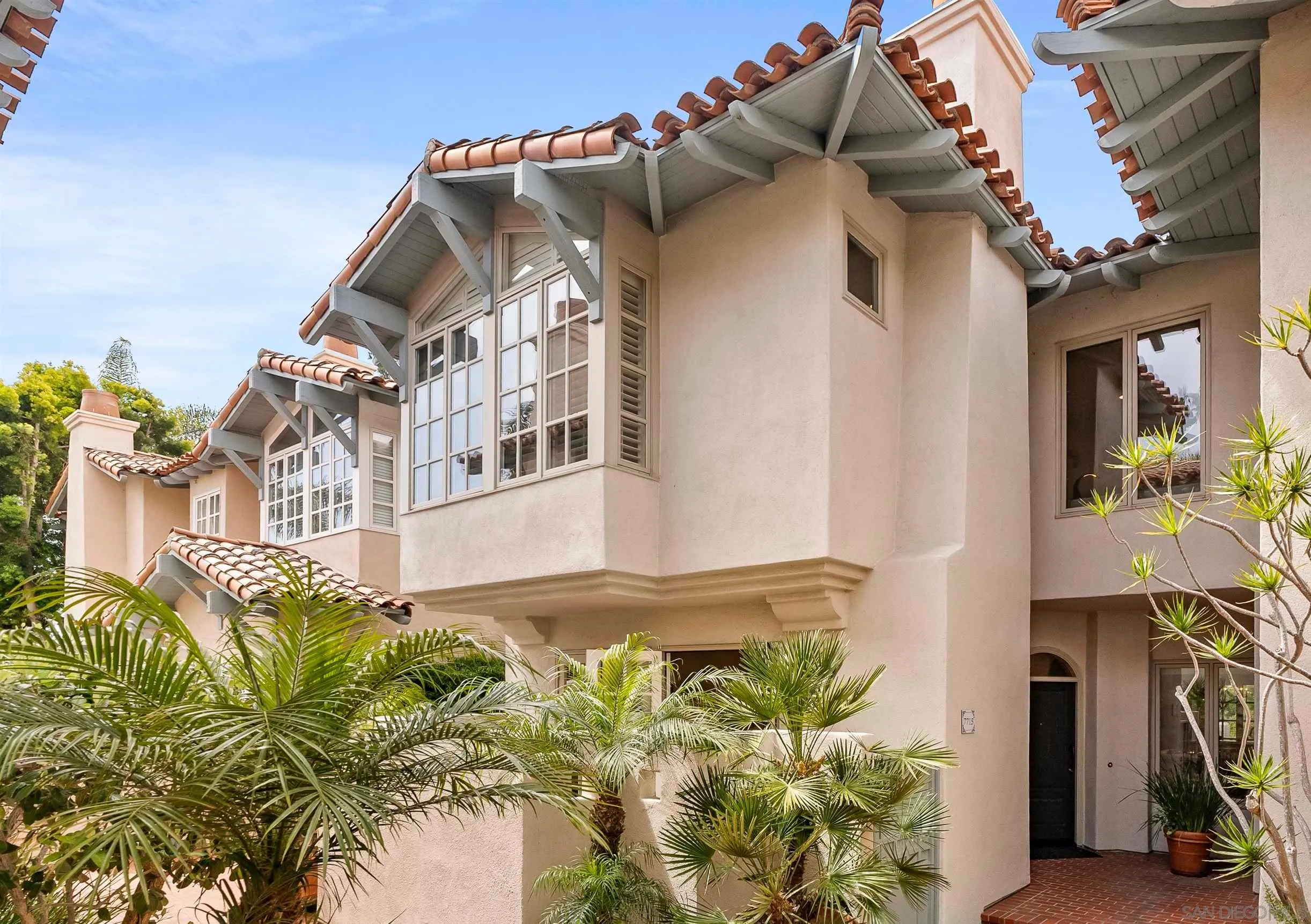 7715 Ivanhoe Avenue La Jolla, CA 92037 - Photo 27 of 28 a view of a house with a small yard and plants