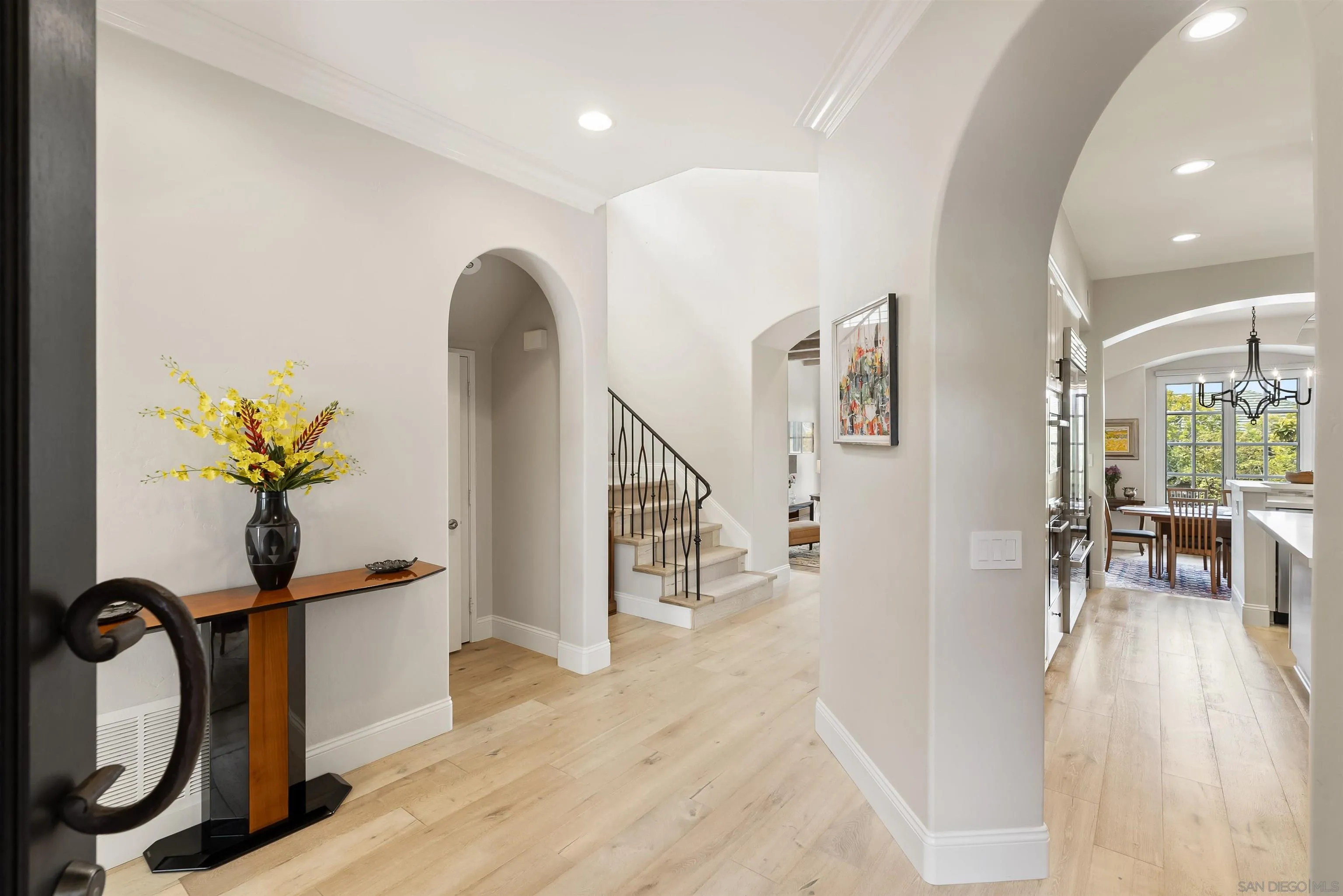 7715 Ivanhoe Avenue La Jolla, CA 92037 - Photo 28 of 28 a view of a entryway with furniture and wooden floor