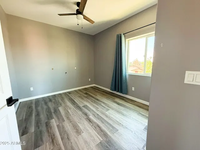 a view of an empty room and window