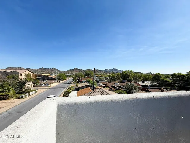 a view of a city street with tall buildings