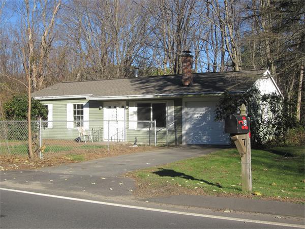 34 West Farms Road Northampton, MA 01062 - Photo 2 of 2 a front view of a house with a garden