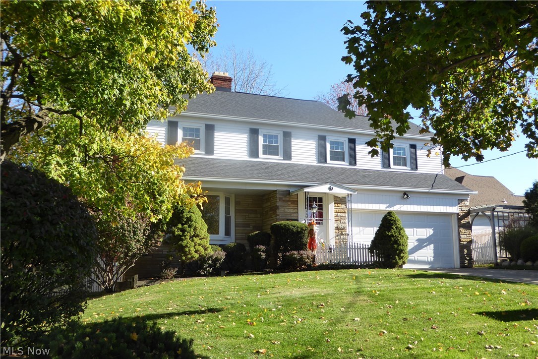 1443 Clearview, Lyndhurst. Details such as the decorative picket fence, the trellis, bay window, stone facade create an attractive exterior presentation with "curb appeal".