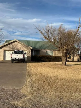 a view of parking area and tree