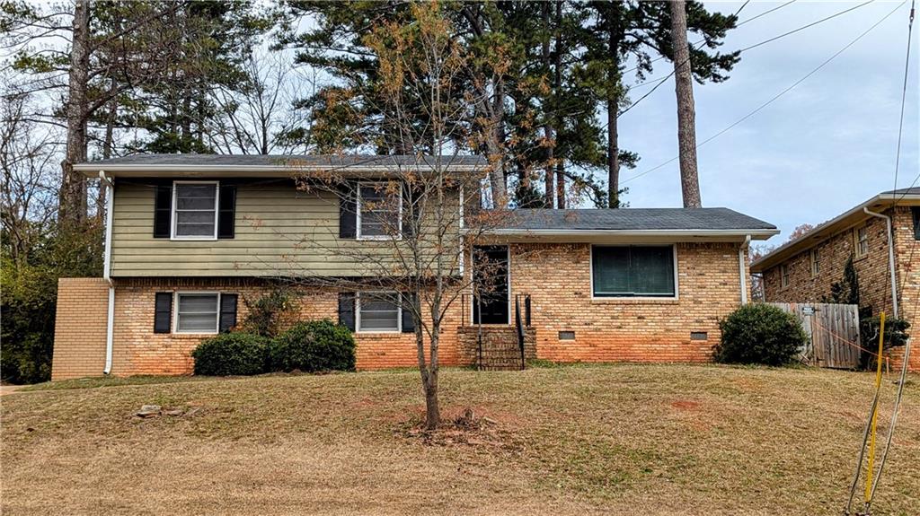 3582 Crown Point Court Decatur, GA 30032 - Photo 1 of 1 a front view of a house with a yard and garage