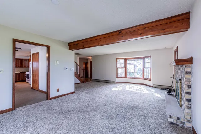 a view of empty room with windows