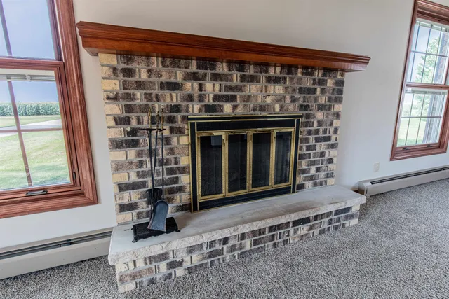 a front view of a house with a large window