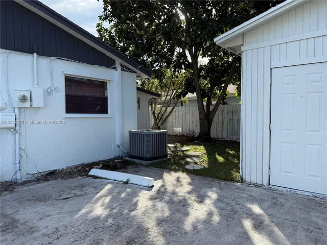 a house view with a backyard space