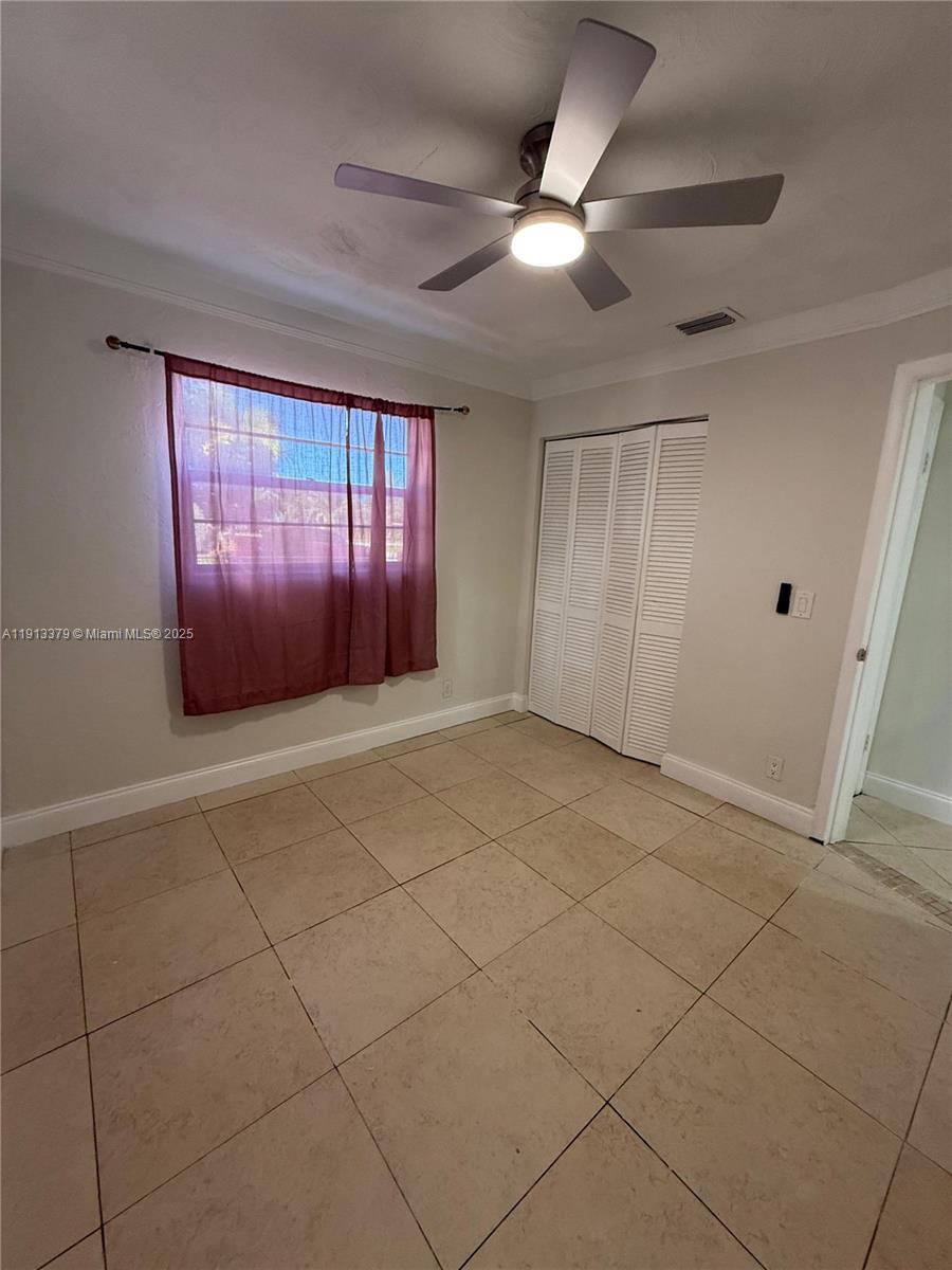 601 Southwest 10th Street Delray Beach, FL 33444 - Photo 9 of 17 a view of an empty room with a window
