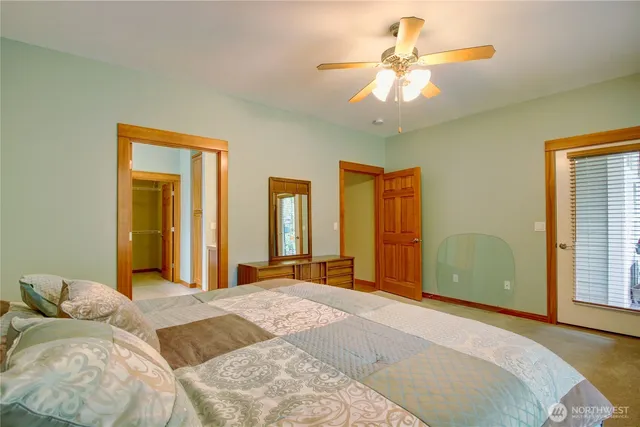 a living room with lots of furniture and kitchen view