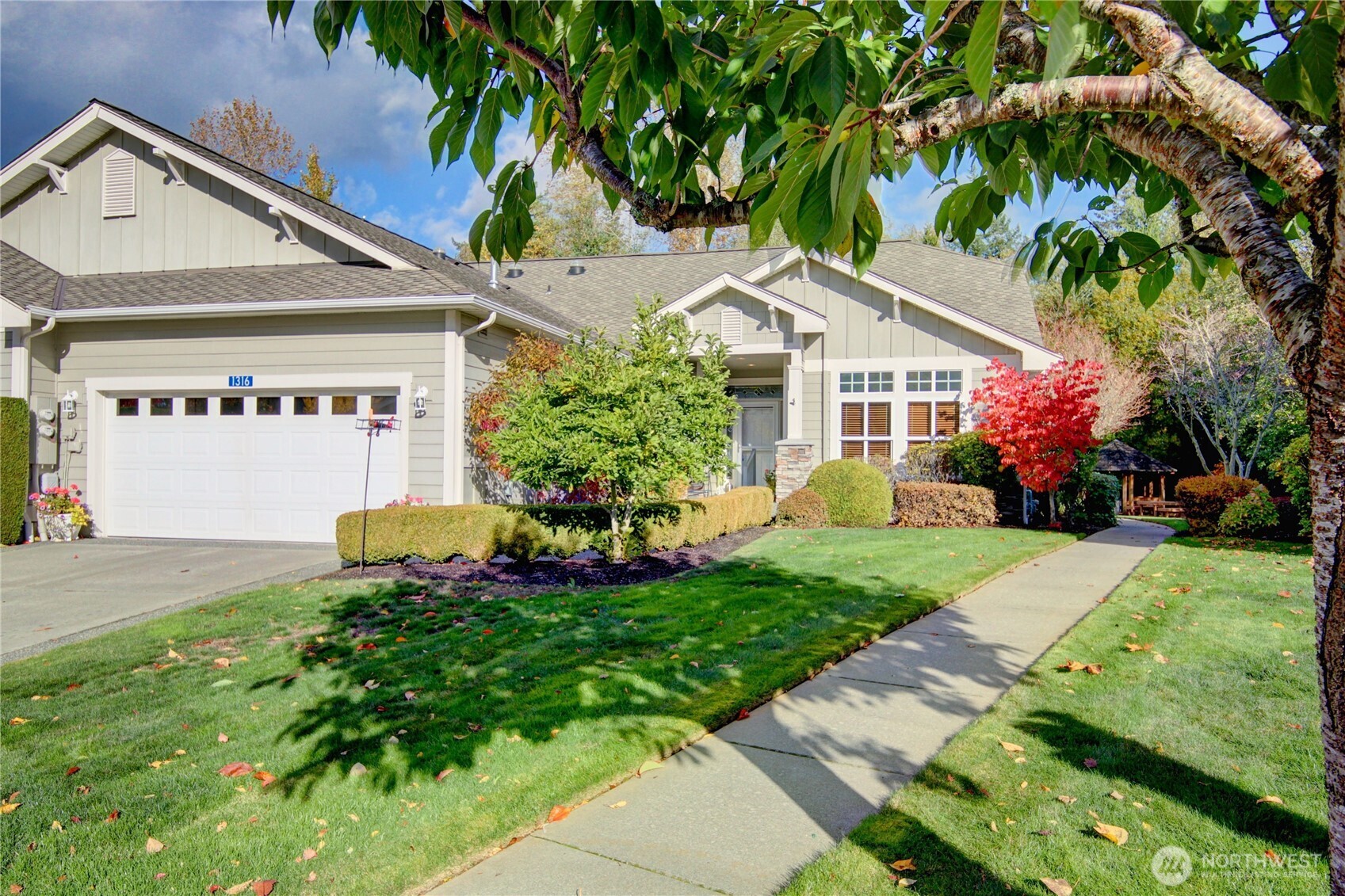 1316 Eagle Ridge Drive, Unit 4 Mount Vernon, WA 98274 - Photo 2 of 29 a front view of a house with garden