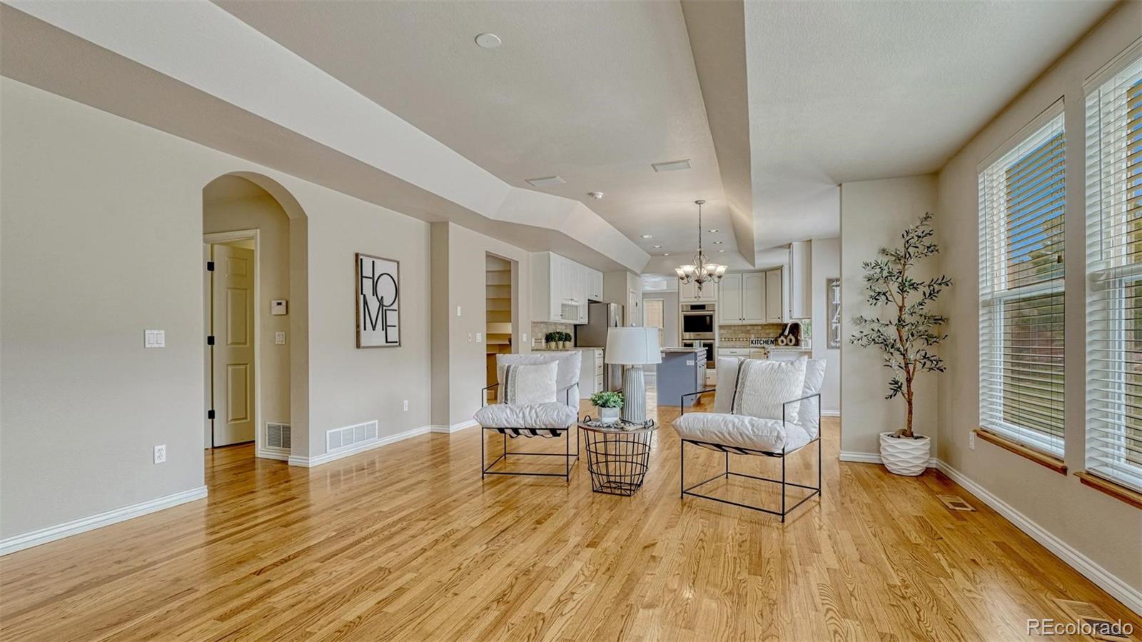 15211 Ridgefield Lane Colorado Springs, CO 80921 - Photo 15 of 47 a living room with furniture and a wooden floor