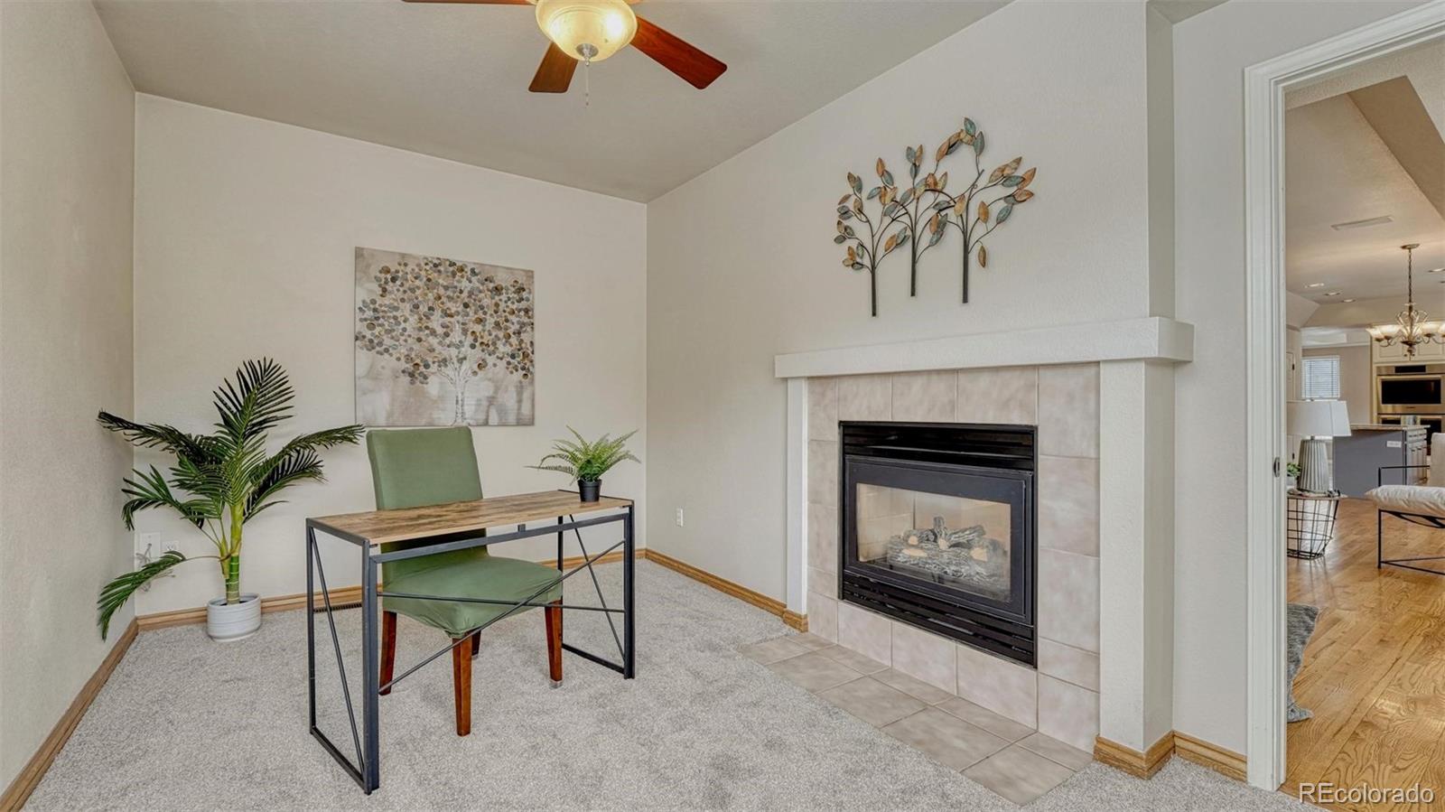 15211 Ridgefield Lane Colorado Springs, CO 80921 - Photo 16 of 47 a living room with furniture and a fireplace