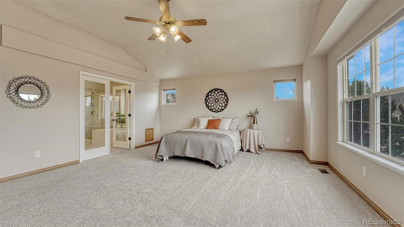 15211 Ridgefield Lane Colorado Springs, CO 80921 - Photo 19 of 47 a bedroom with a bed and a window