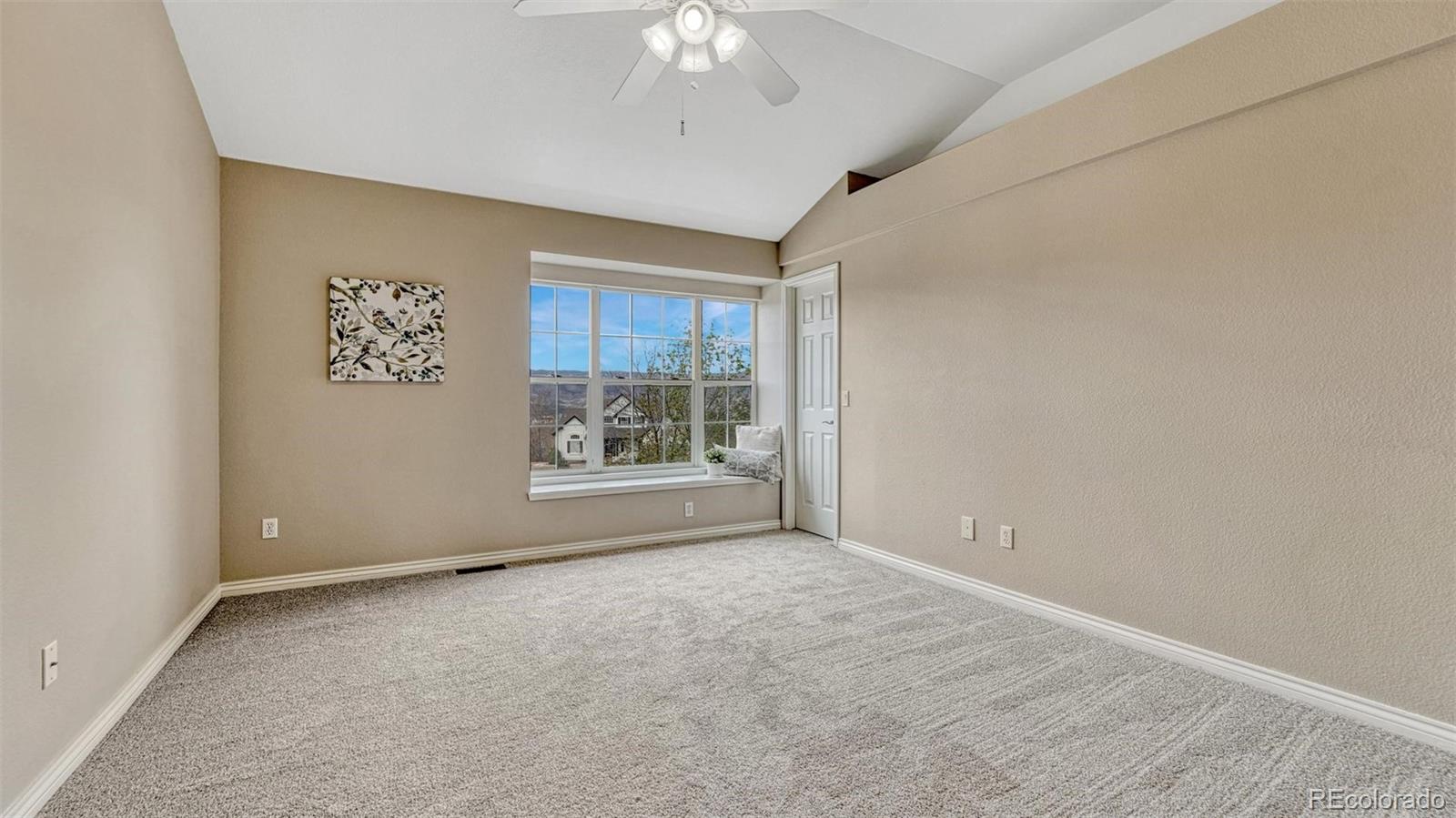15211 Ridgefield Lane Colorado Springs, CO 80921 - Photo 24 of 47 an empty room with a window