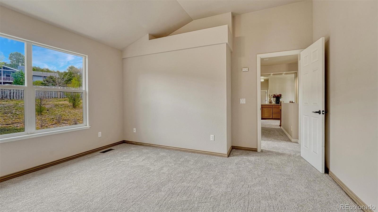 15211 Ridgefield Lane Colorado Springs, CO 80921 - Photo 25 of 47 a view of an empty room with a window