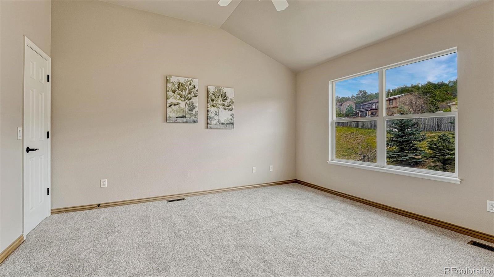 15211 Ridgefield Lane Colorado Springs, CO 80921 - Photo 28 of 47 an empty room with windows