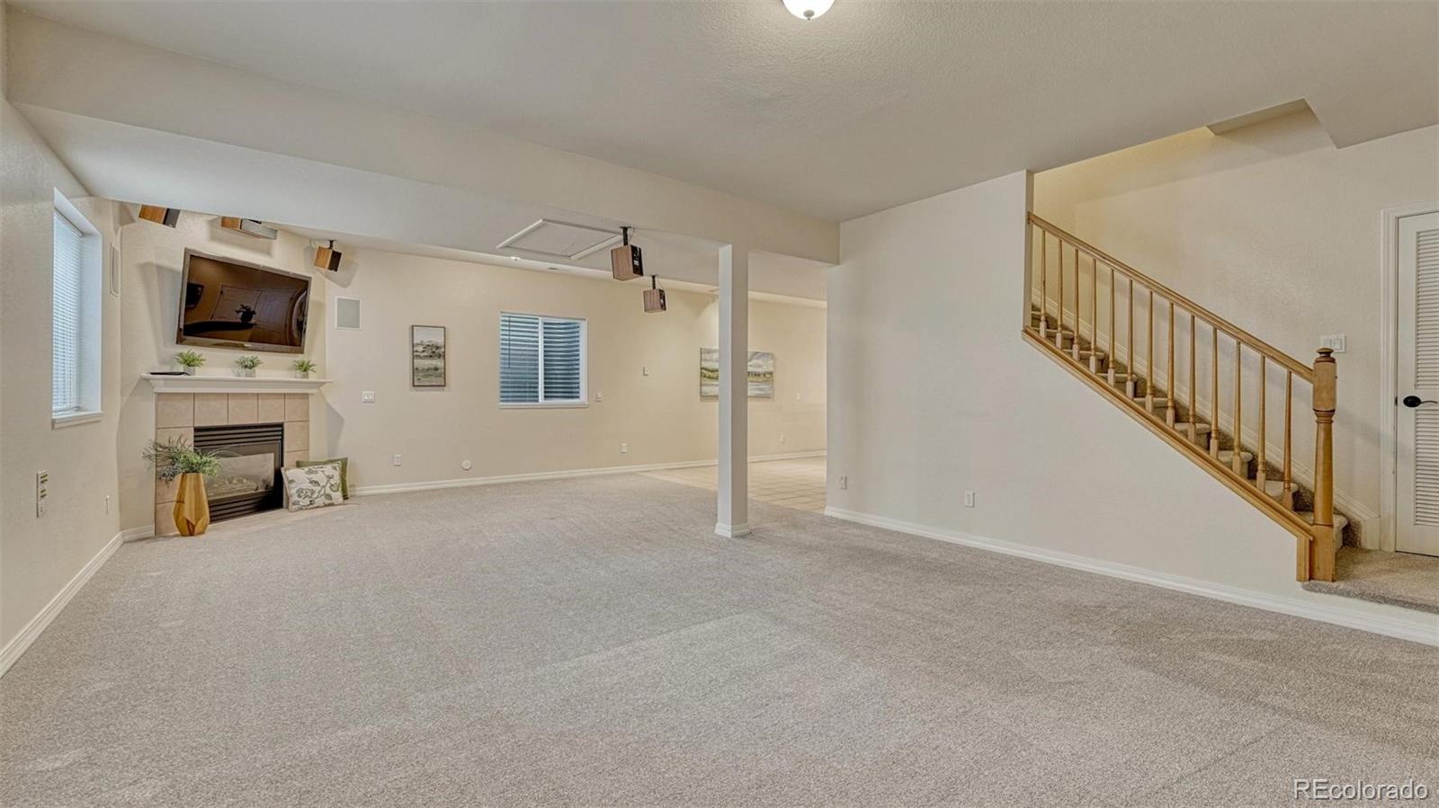 15211 Ridgefield Lane Colorado Springs, CO 80921 - Photo 30 of 47 a view of an empty room with a fireplace