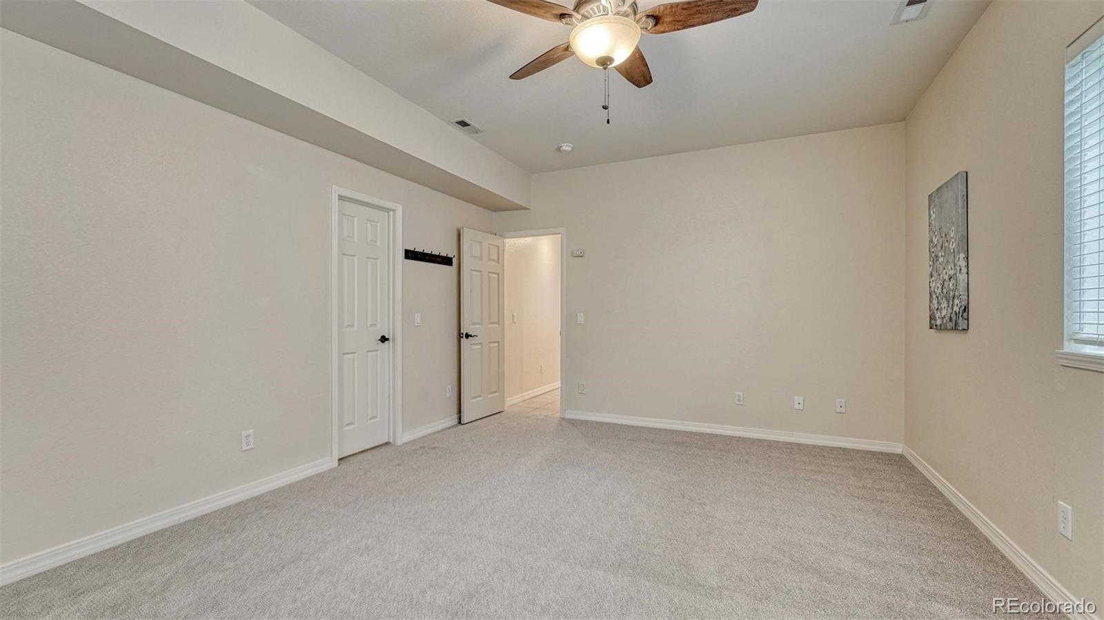 15211 Ridgefield Lane Colorado Springs, CO 80921 - Photo 37 of 47 wooden floor in an empty room