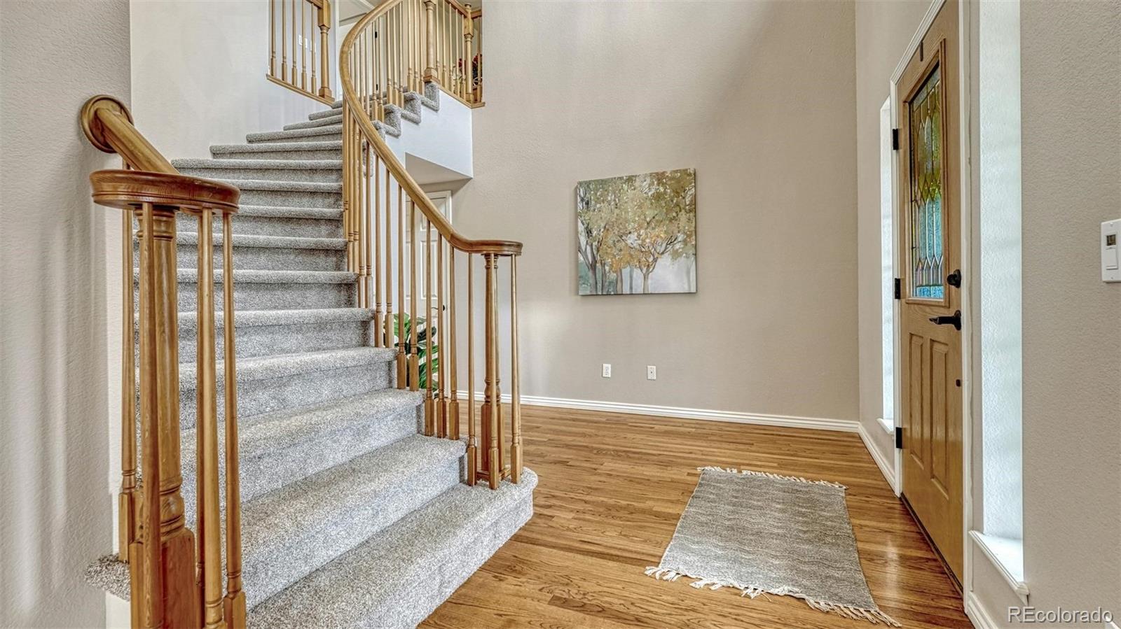 15211 Ridgefield Lane Colorado Springs, CO 80921 - Photo 4 of 47 a view of an entryway with staircase