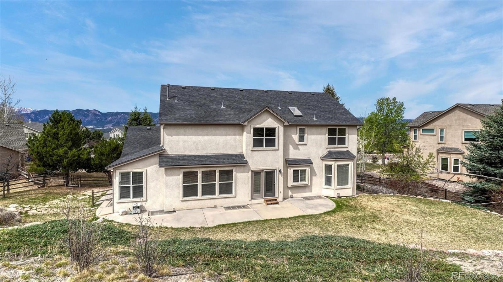 15211 Ridgefield Lane Colorado Springs, CO 80921 - Photo 41 of 47 front view of a house with a yard