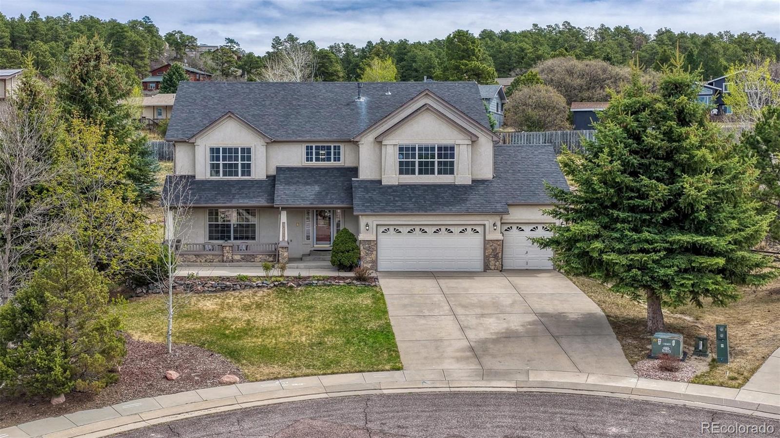 15211 Ridgefield Lane Colorado Springs, CO 80921 - Photo 45 of 47 a aerial view of a house with a yard table and chairs
