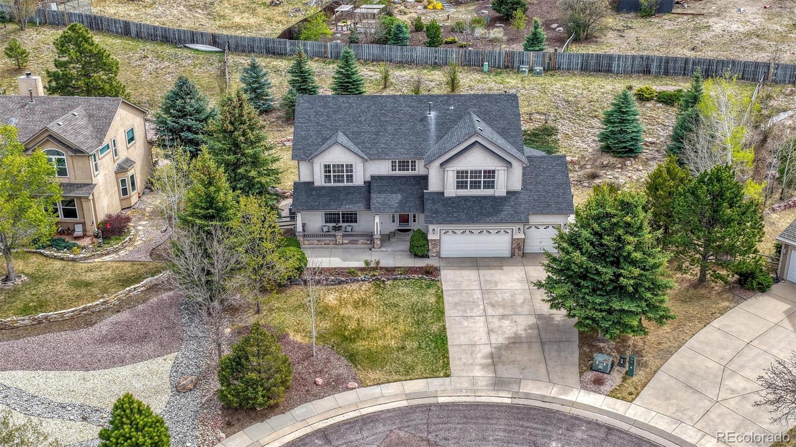 15211 Ridgefield Lane Colorado Springs, CO 80921 - Photo 46 of 47 an aerial view of a house with a lake view