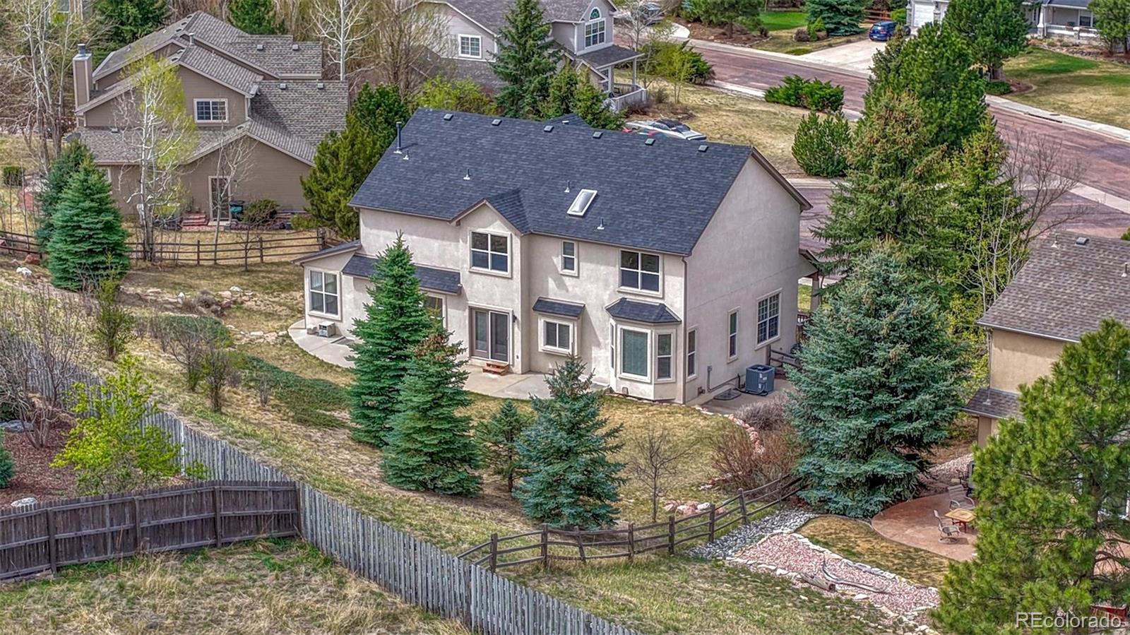15211 Ridgefield Lane Colorado Springs, CO 80921 - Photo 47 of 47 a aerial view of a house with wooden fence