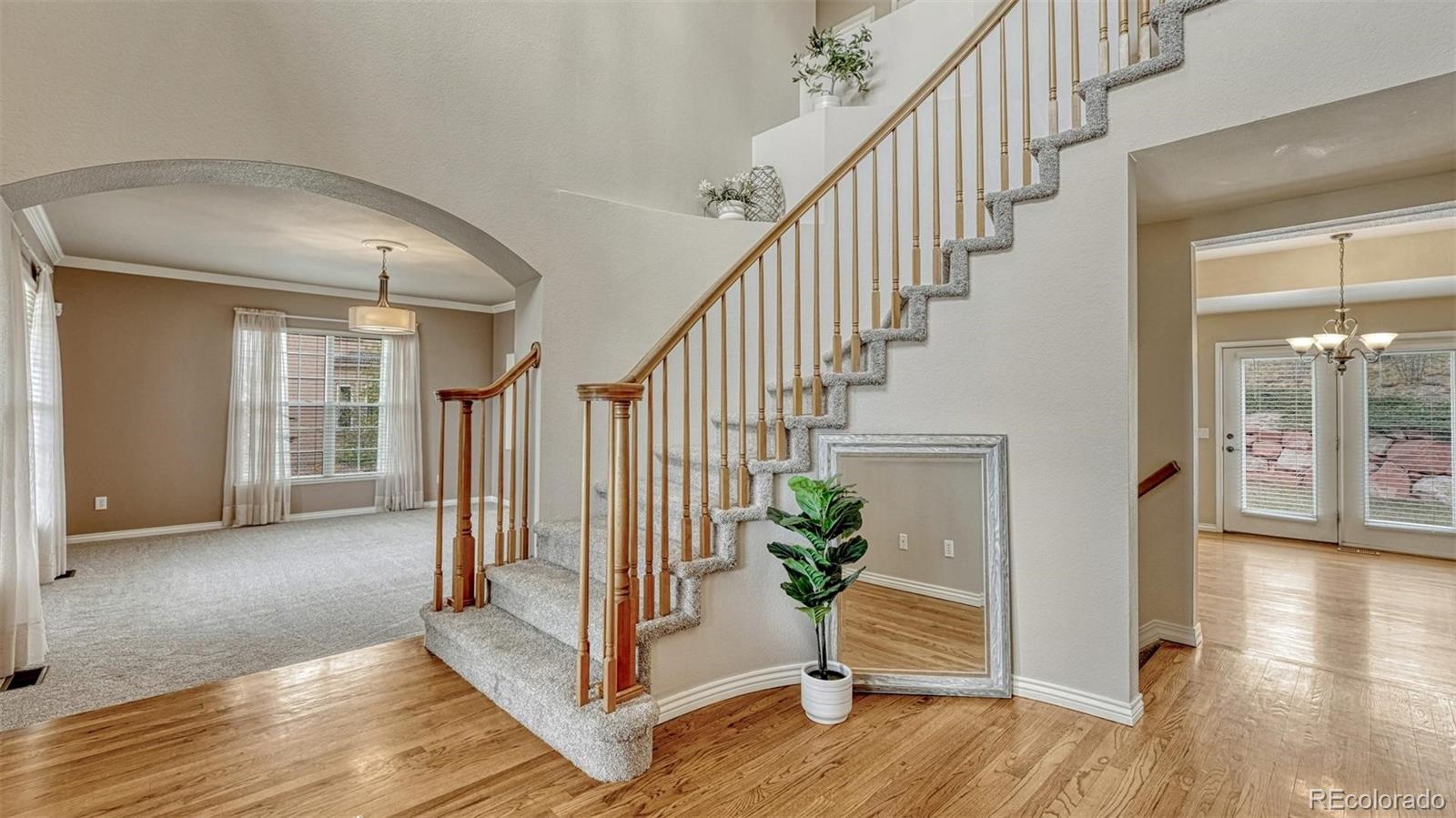 15211 Ridgefield Lane Colorado Springs, CO 80921 - Photo 5 of 47 a view of entryway with wooden floor and stairs