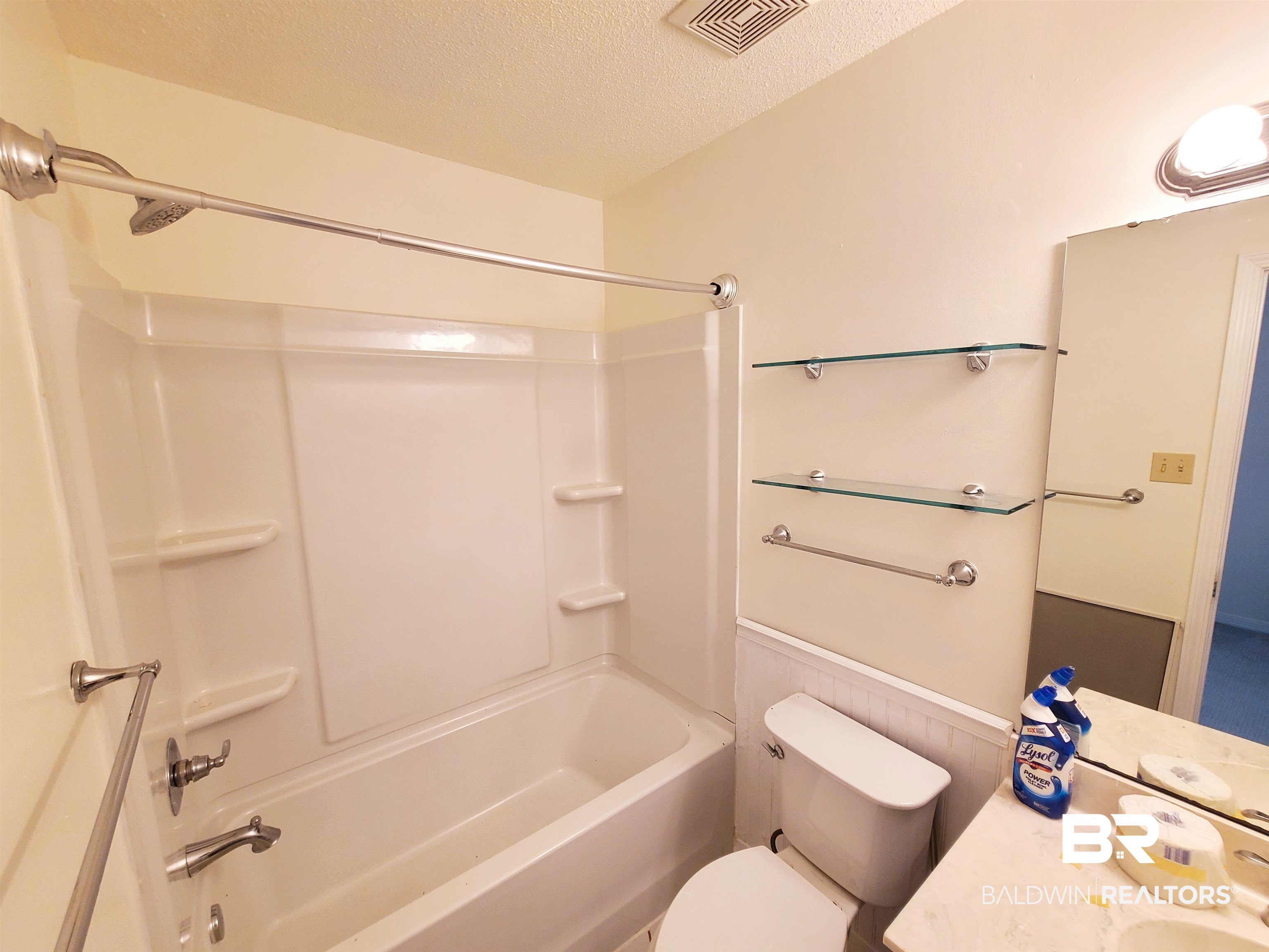 123 Melanie Loop Daphne, AL 36526 - Photo 11 of 17 Bathroom with a textured ceiling, tub / shower combination, and vanity