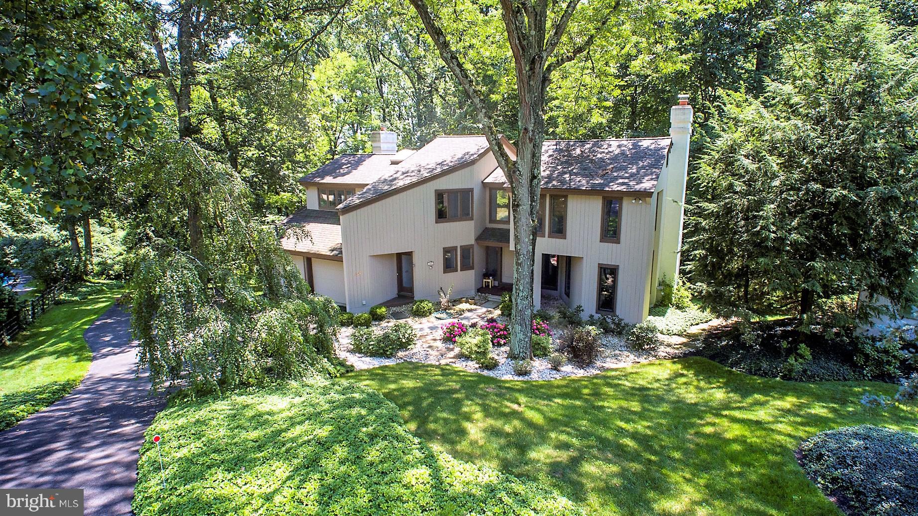309 Valley Place Radnor, PA 19087 - Photo 1 of 39 a view of a house with a yard and garden