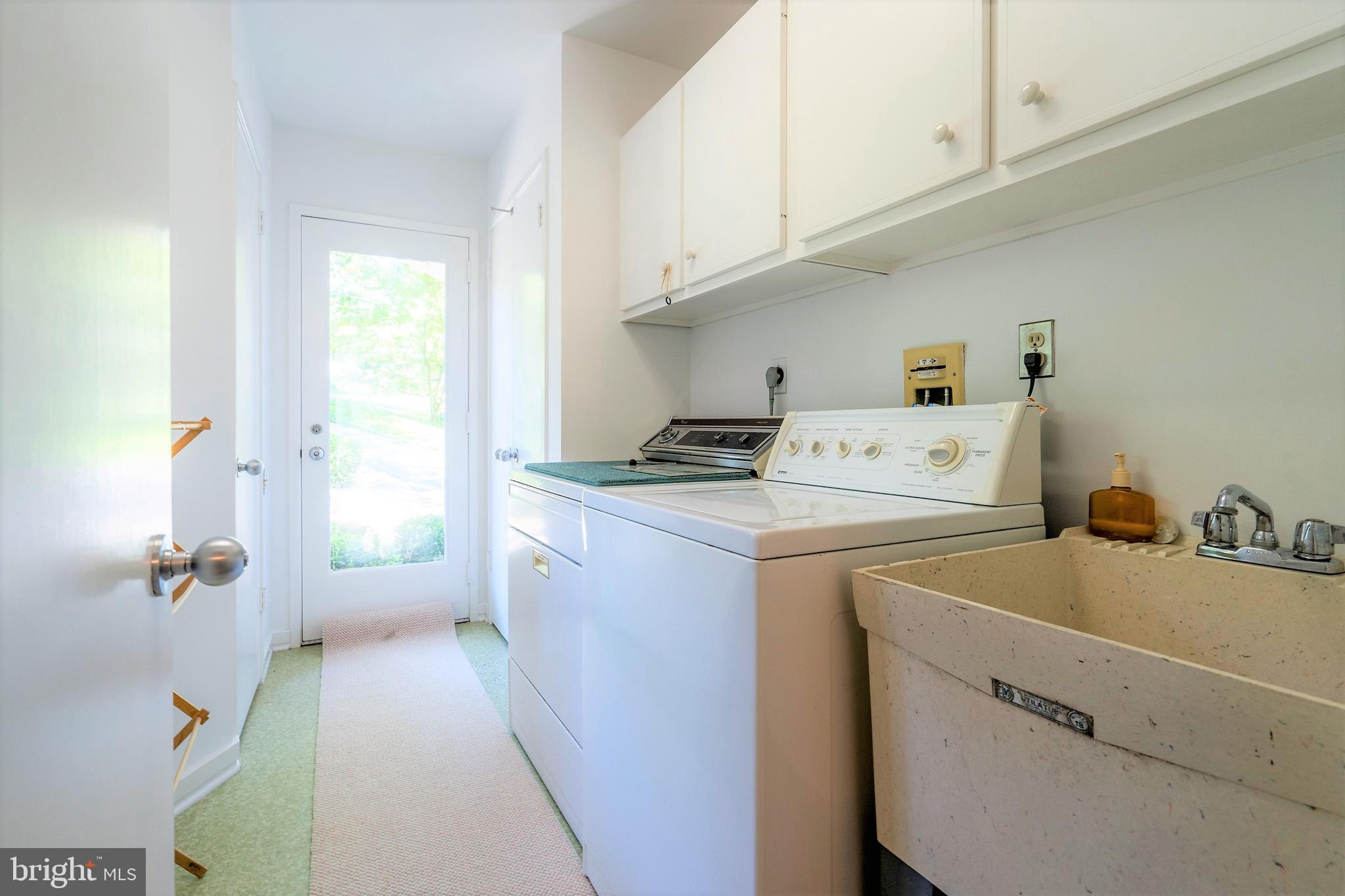 309 Valley Place Radnor, PA 19087 - Photo 26 of 39 a utility room with dryer and washer