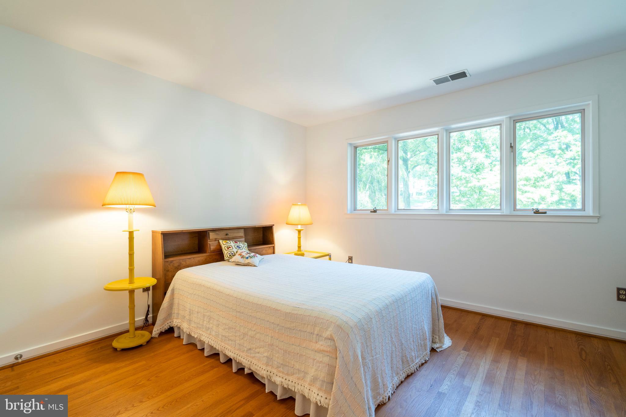 309 Valley Place Radnor, PA 19087 - Photo 33 of 39 a bedroom with a bed and a lamp