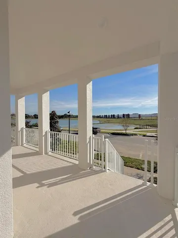 a view of a balcony and ocean view