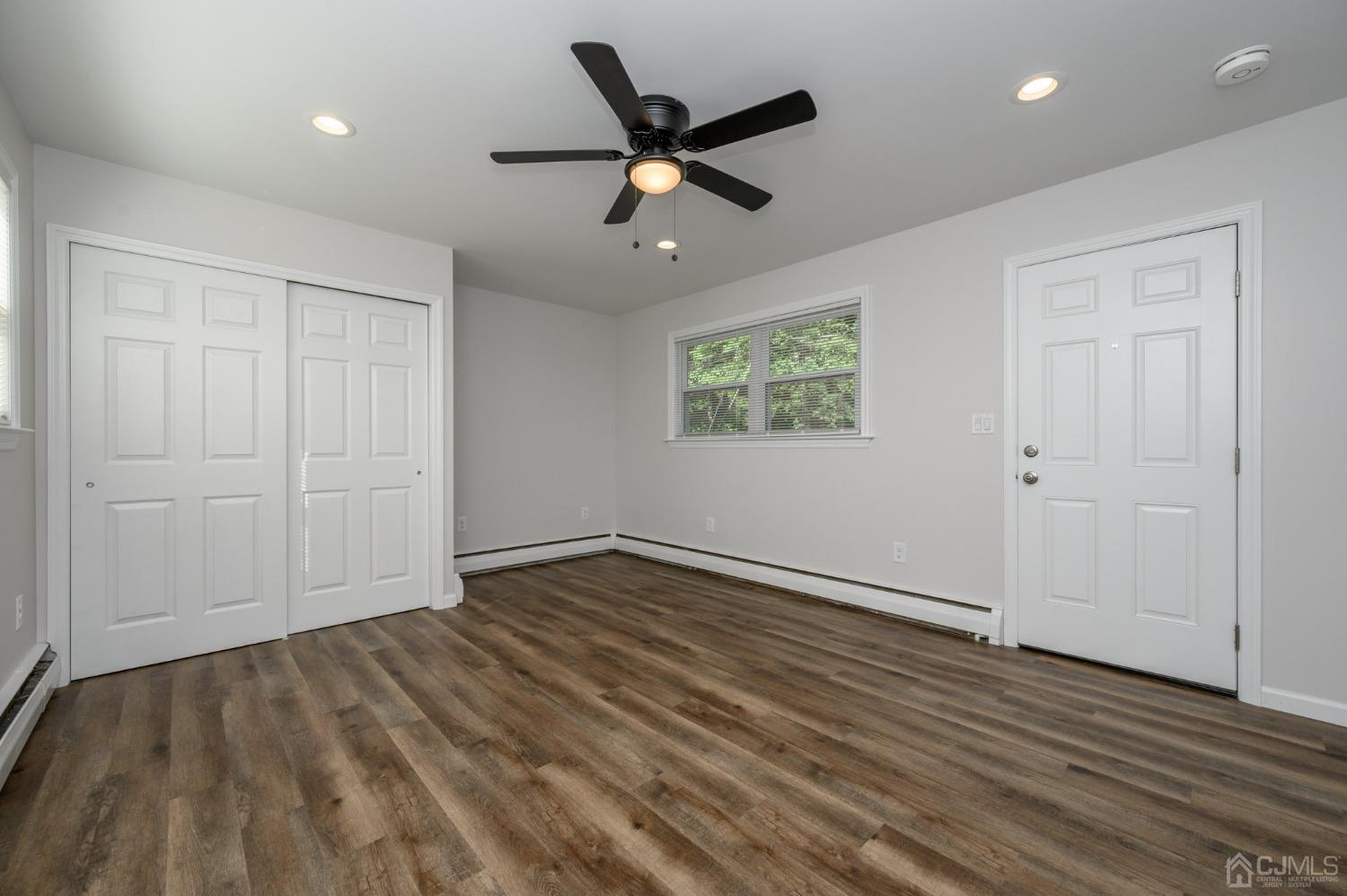 16 Green Road Mine Hill, NJ 07803 - Photo 14 of 53 wooden floor in an empty room with a ceiling fan