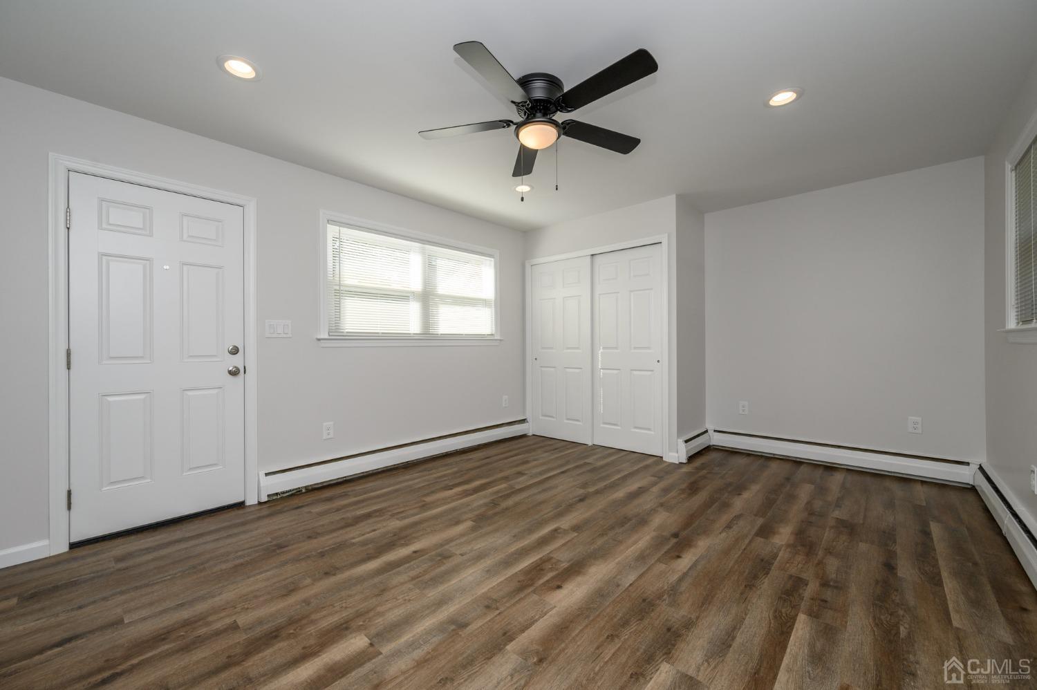 16 Green Road Mine Hill, NJ 07803 - Photo 15 of 53 wooden floor in an empty room with a window