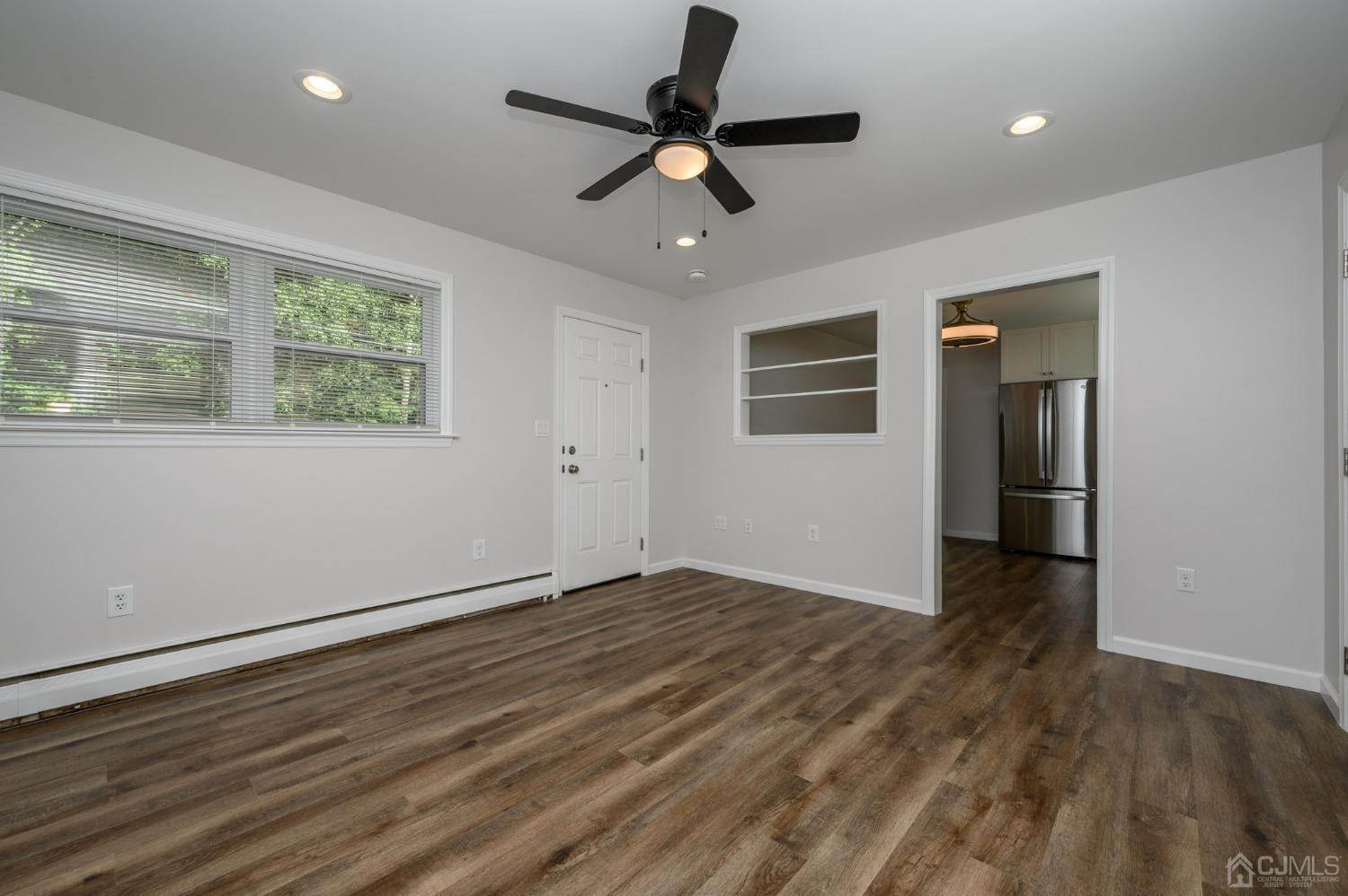 16 Green Road Mine Hill, NJ 07803 - Photo 17 of 53 a view of an empty room with wooden floor and a window