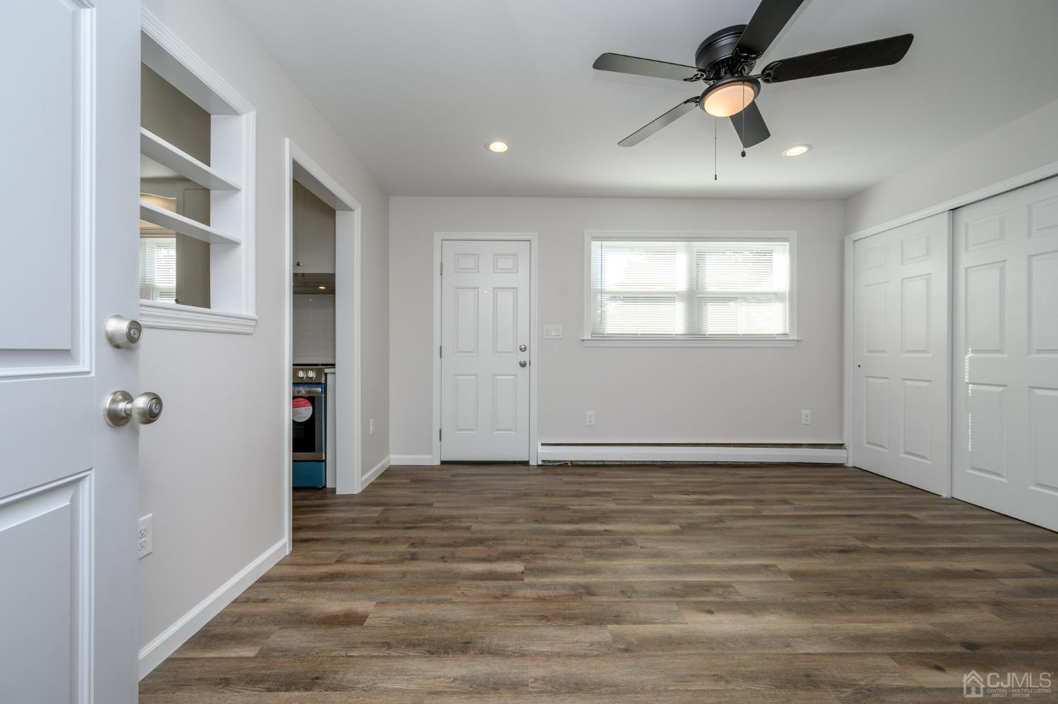 16 Green Road Mine Hill, NJ 07803 - Photo 18 of 53 wooden floor in an empty room with a window