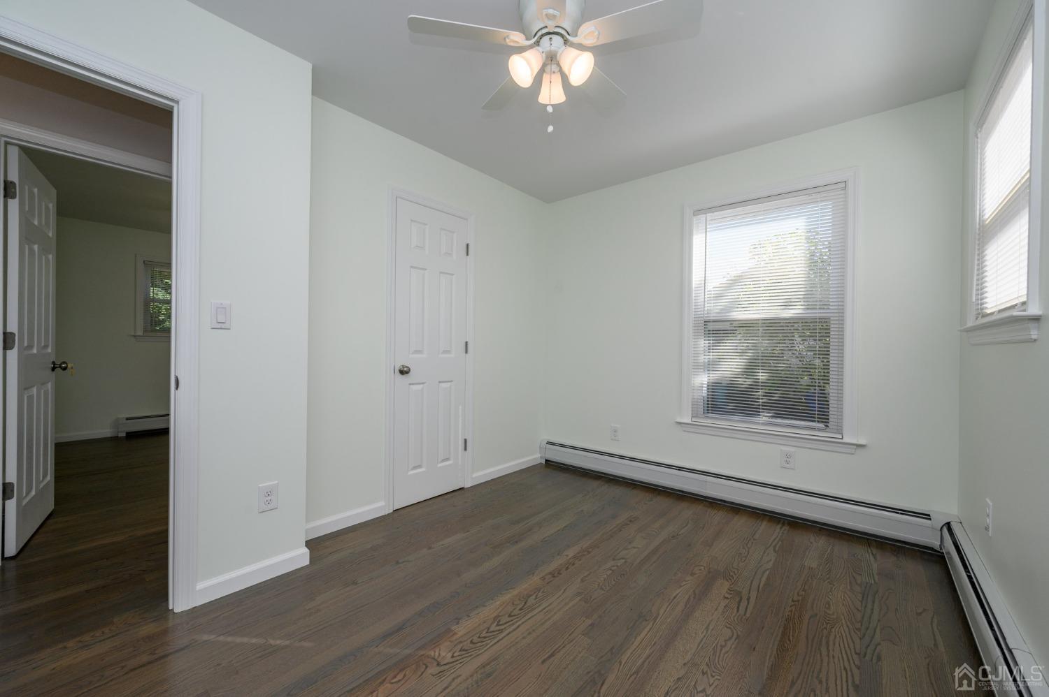 16 Green Road Mine Hill, NJ 07803 - Photo 21 of 53 an empty room with wooden floor and windows