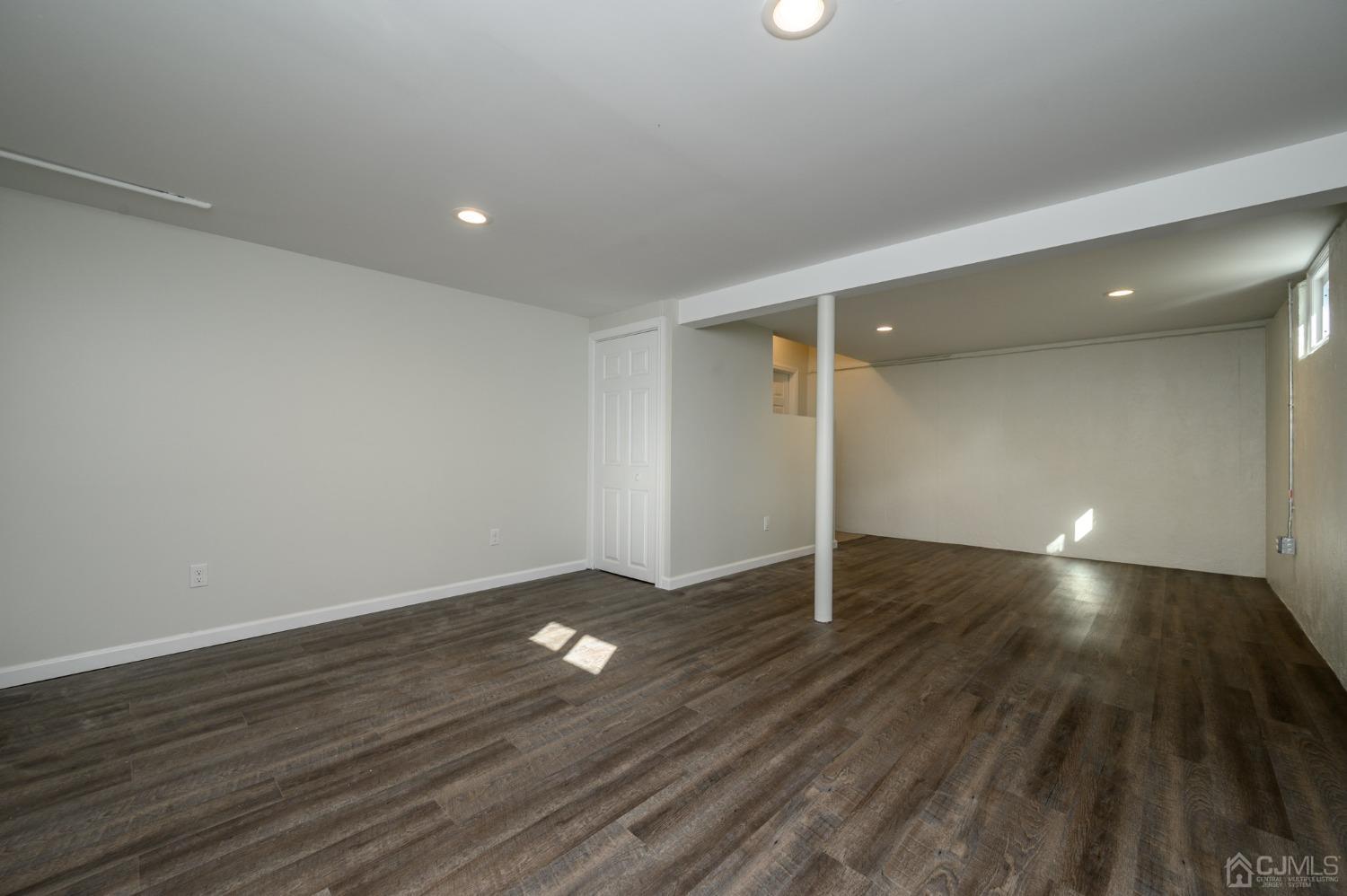 16 Green Road Mine Hill, NJ 07803 - Photo 35 of 53 an empty room with wooden floor and windows