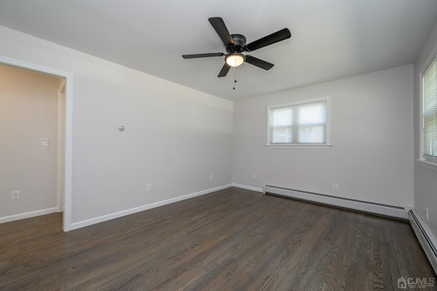 16 Green Road Mine Hill, NJ 07803 - Photo 4 of 53 a view of an empty room with wooden floor and a window
