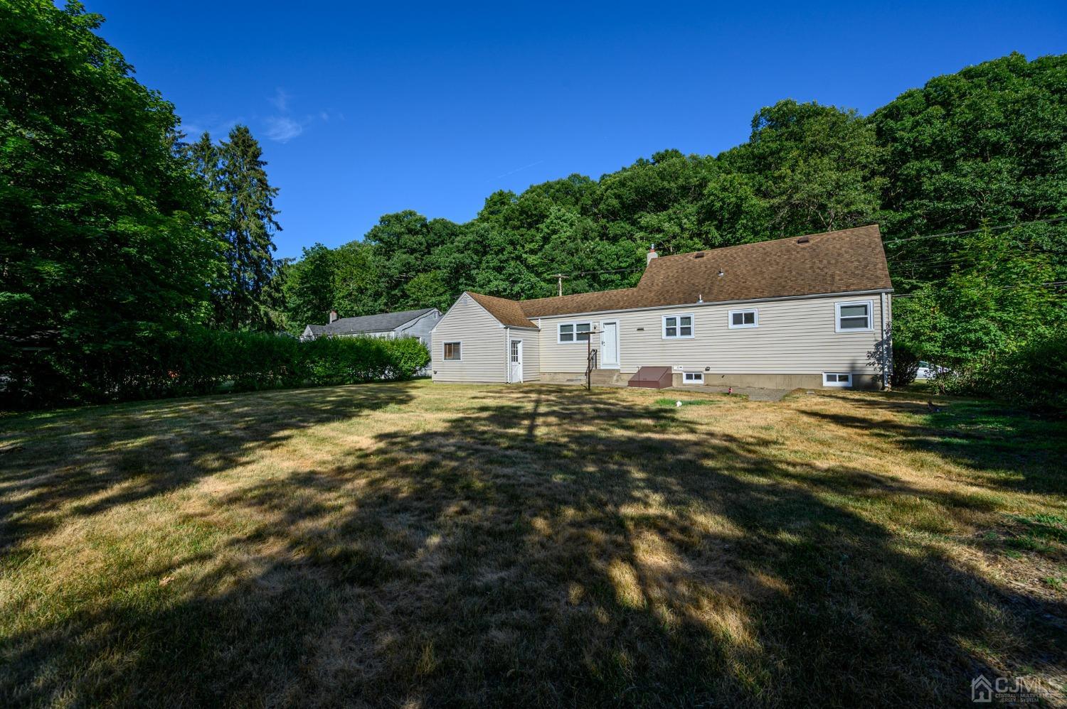 16 Green Road Mine Hill, NJ 07803 - Photo 42 of 53 a aerial view of house with yard and trees in the background