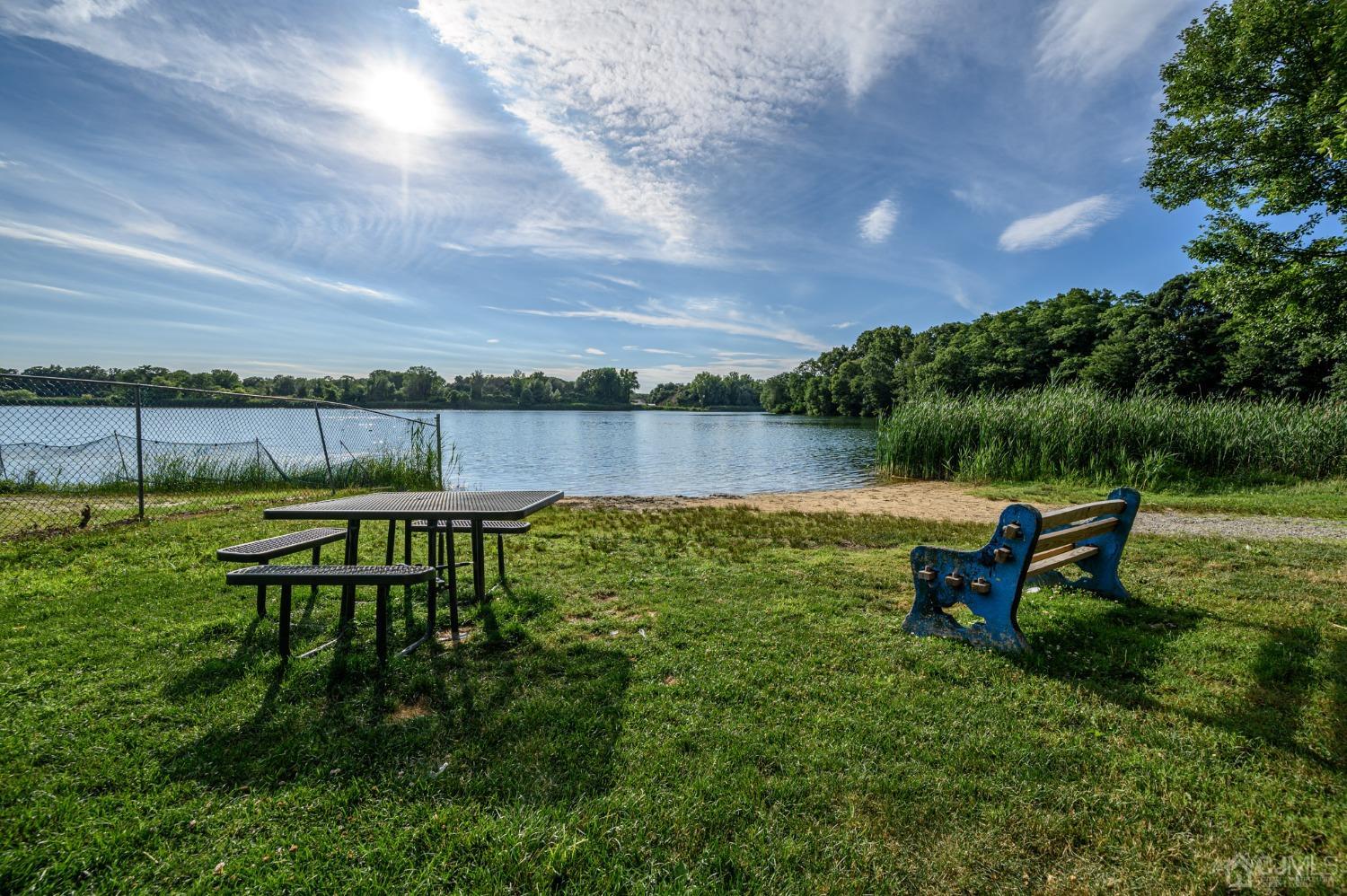 16 Green Road Mine Hill, NJ 07803 - Photo 48 of 53 a view of a lake with a bench and trees