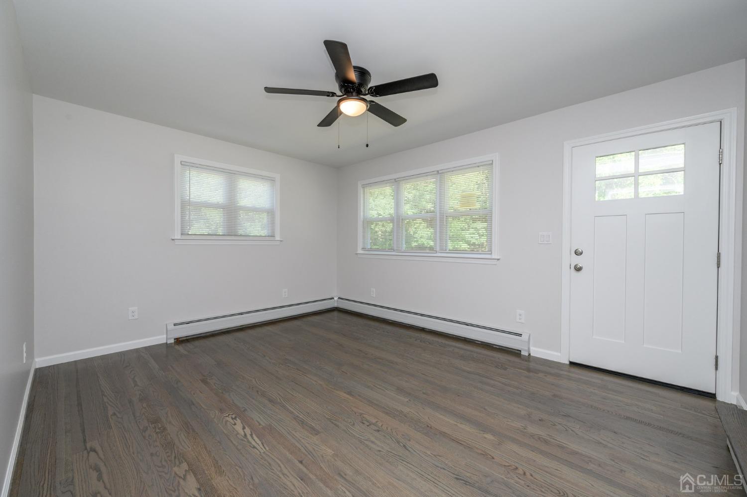 16 Green Road Mine Hill, NJ 07803 - Photo 5 of 53 an empty room with wooden floor fan and windows