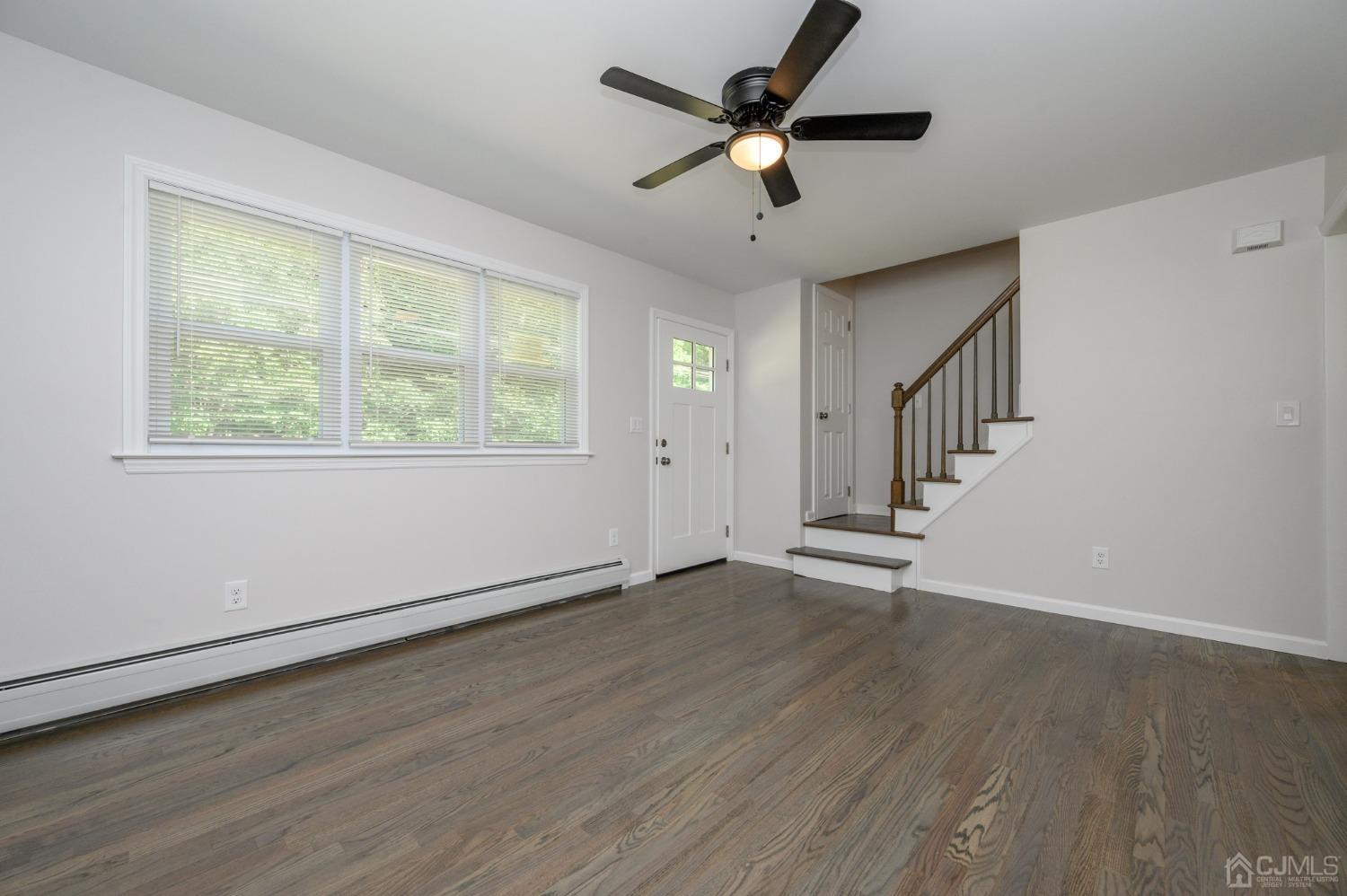 16 Green Road Mine Hill, NJ 07803 - Photo 6 of 53 a view of an empty room with wooden floor and a window