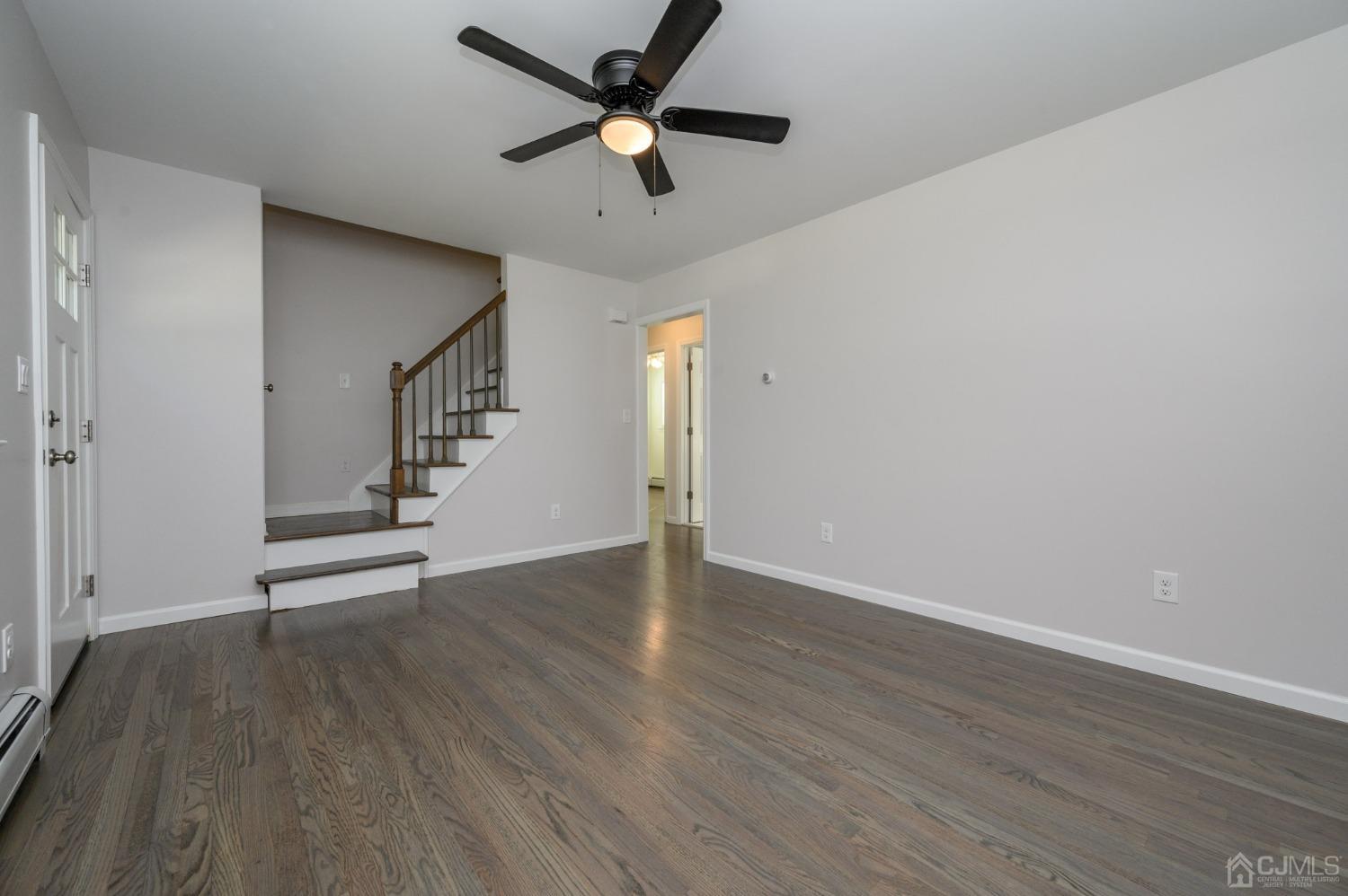16 Green Road Mine Hill, NJ 07803 - Photo 7 of 53 a view of an empty room with wooden floor and a ceiling fan