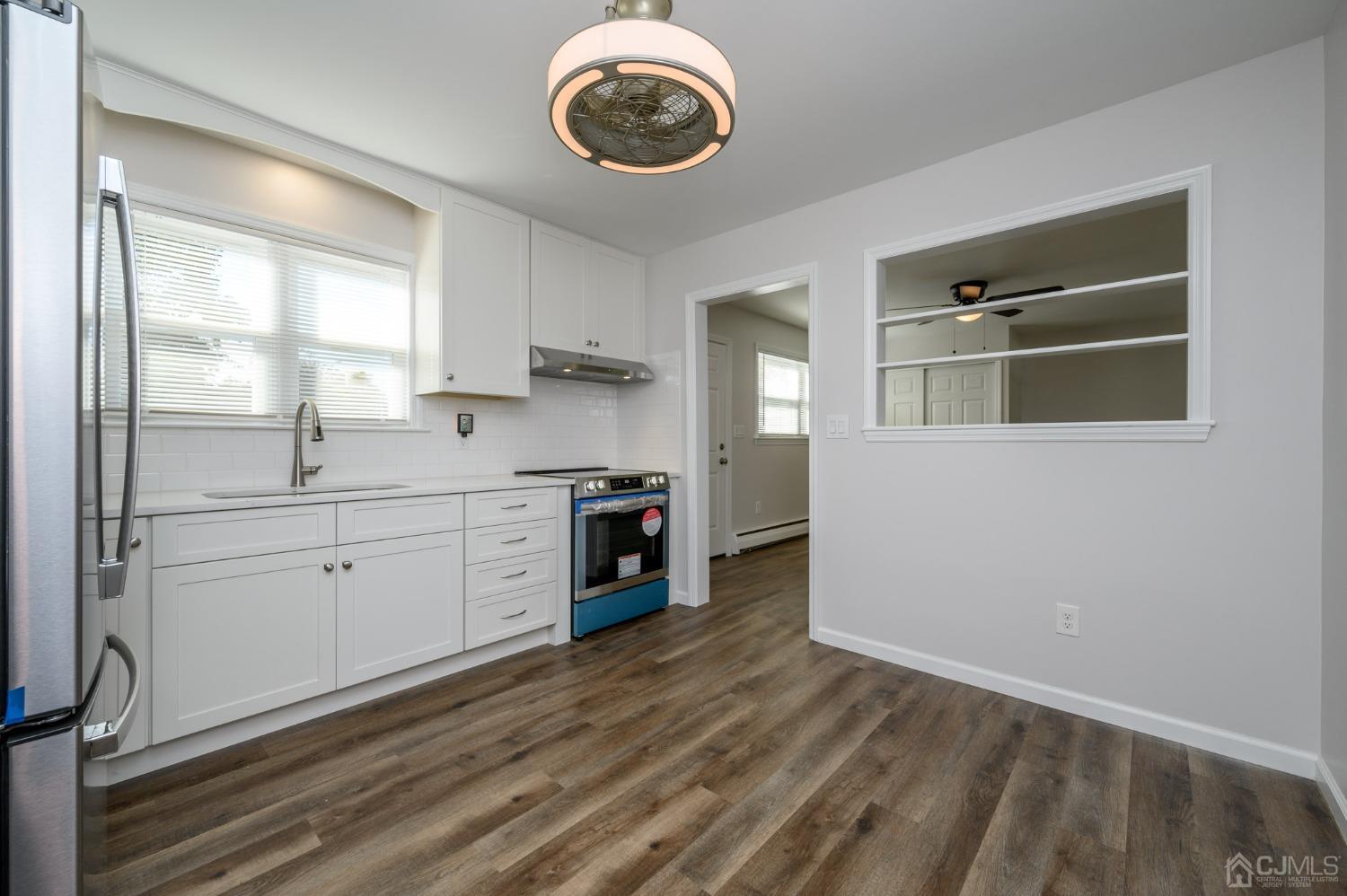 16 Green Road Mine Hill, NJ 07803 - Photo 8 of 53 a kitchen with a stove cabinets and wooden floor