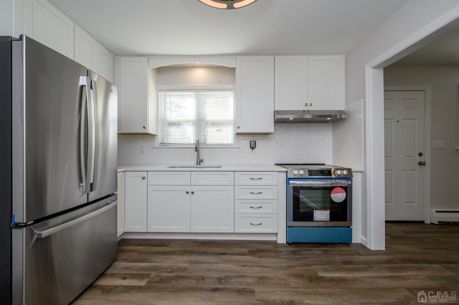 16 Green Road Mine Hill, NJ 07803 - Photo 9 of 53 a kitchen with stainless steel appliances granite countertop a refrigerator and a stove