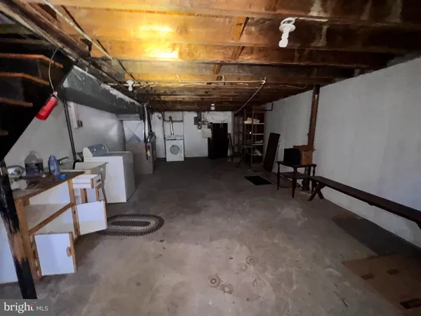 a view of storage and utility room with a sink