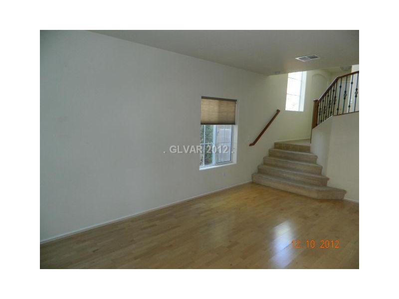 205 Heiple Court Henderson, NV 89052 - Photo 3 of 35 Living Room. STEP DOWN LIVING ROOM WITH WOOD LAMINATE FLOOR